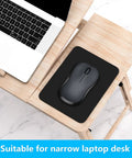 Small Mouse Pad 8 By 6 Inch Thick Rubber With Premium Textured Non Slip Surface, Portable, on a wooden desk with laptop.