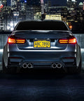 Car with Magnetic License Plate Holder For Metal Bumpers 4 Pack Neodymium Magnets With Rubber Coated Mounts at night cityscape