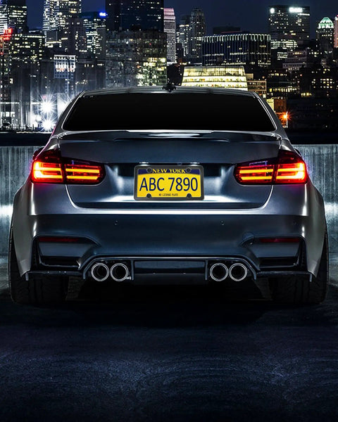 Car with Magnetic License Plate Holder For Metal Bumpers 4 Pack Neodymium Magnets With Rubber Coated Mounts at night cityscape