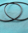 Top Shelf Three Rib Drive Belt Set For 10 Inch Benchtop Jointer Planer Machines on blue fabric background.