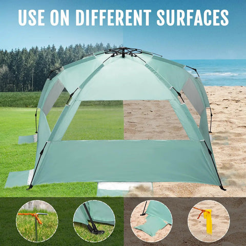 Deluxe XL Pop Up Beach Tent Sun Shade For 3 To 4 People With UV Protection on sand and grass surfaces, mint green color.