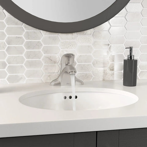 Reliant 1-Handle 4-Inch Centerset Bathroom Faucet In Brushed Nickel With Ceramic Disc Valve 1.2 GPM installed on a modern sink