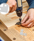 Person using a drill to install 100Pcs Stainless Steel L Brackets 1.6 X 1.6 Inch Beefy Built Right Angle Brace on wooden surface