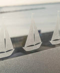 Milky Privacy Window Film With Reusable Static Cling No Fuss Removable Frosted Glass Film For Windows Doors And Showers Easy Peel Repositionable And Durable Roll 17 By 59 Inches installed on glass with sailboat pattern.
