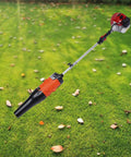 52CC Gas Walk Behind Sweeper Powered By A Muscle 2.3HP Two Stroke Engine displayed on grassy surface with fallen leaves.