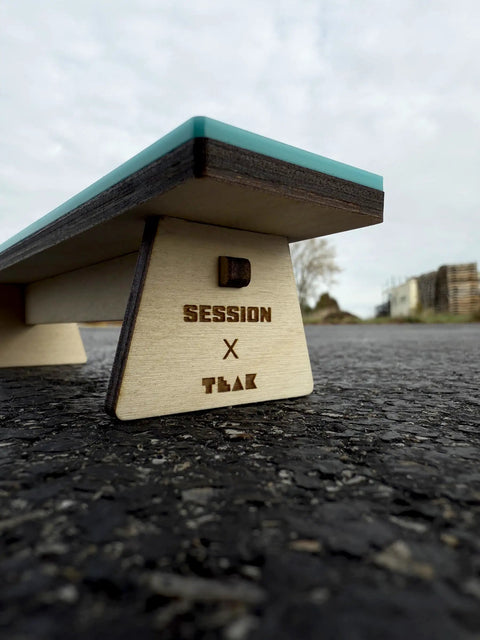 Side view of Wooden Fingerboard Bench Obstacle with Baltic Birch Wood and Teal Acrylic Surface for smooth fast slides.