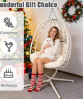 Woman sitting in a Chill Ready Egg Shaped Hammock Chair For Indoor And Outdoor Use With Removable Washable Cushion And Breathable Woven Design