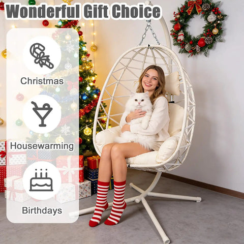 Woman sitting in a Chill Ready Egg Shaped Hammock Chair For Indoor And Outdoor Use With Removable Washable Cushion And Breathable Woven Design