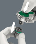 Close-up of a hand using Zyklop 8000 B SB Ratchet Five In One Fine Tooth Tool with 3/8 inch drive, showing push button release mechanism.