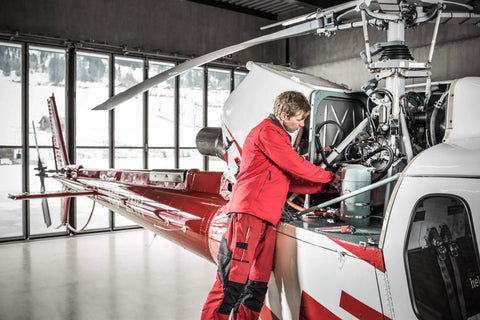 Technician using SwissGrip Slotted And Phillips Screwdriver Kit In Tobacco Brown on helicopter repair in hangar