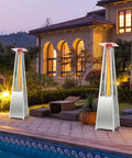 42,000 BTU Pyramid Propane Patio Heater With Dancing Flame on deck near a pool, showcasing quartz glass tube and hammered stainless steel.