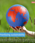 Hand holding blue and red globe in grassy field, promoting sustainability focus by tesa with prioritizing sustainability text.