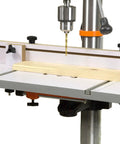 24x12 Inch Drill Press Table with adjustable fence and stop block on a drill press, expanding workspace by 275 square inches.