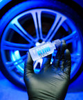 Rim EVO 30ml Ceramic Wheel Coating Kit For Rims High Heat Resistant Up To 1400F Brake Dust Repellent shown in hand against wheel