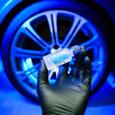 Rim EVO 30ml Ceramic Wheel Coating Kit For Rims High Heat Resistant Up To 1400F Brake Dust Repellent shown in hand against wheel