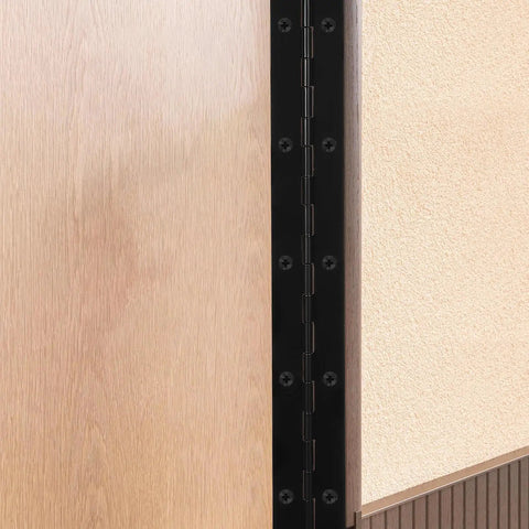 Heavy Duty Metal Piano Hinge Set With Screws For Wood Cabinet Doors And Pianos, black iron, installed on wood panel, close-up view