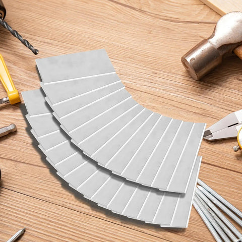 Aluminum Welding Practice Kit 25 Pcs One Eighth Inch Thick 2 by 4 Inch Welding Coupons displayed on a wooden surface