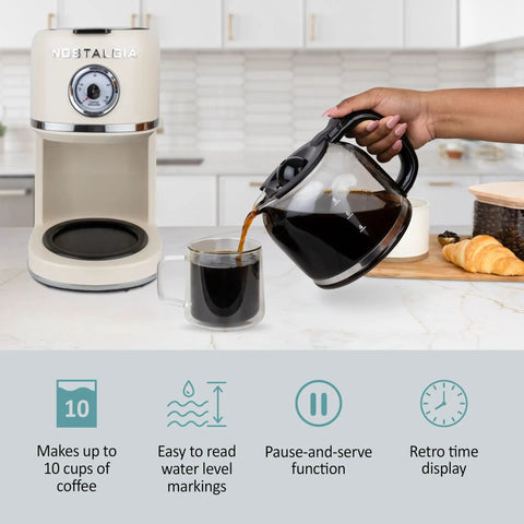 Classic Retro 10 Cup Drip Coffee Maker With One Touch Brew Reusable Filter Auto Shutoff Time Display Anti Drip Dishwasher Safe 50 Ounce Carafe Cream Finish Coffee Machine For Quick Mornings in kitchen, with hand pouring coffee into cup.