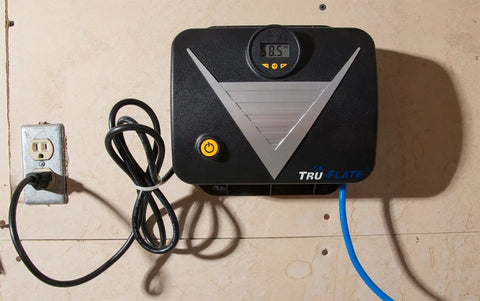 16-250 120V Tankless Wall-Mount Inflator For Tires And Gear, showing digital display and wall-mounted design