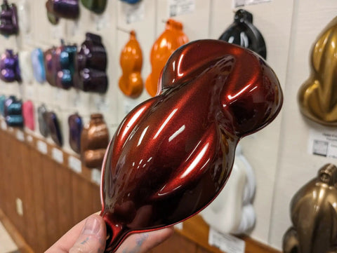 Molten Merlot Professional Car Paint Basecoat Full Gallon Volume Ready To Spray Straight Out The Can With Premium Slow Reducer color sample in hand.