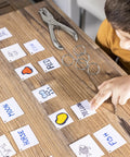 Kid using Super Handy Single Hole Punch For Crafts And Scrapbooks, Quarter Inch Hole, Punches Up To 8 Sheets, Includes 10 Binder Rings, Silver.