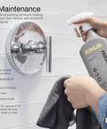 Hand cleaning shower fixture with KOHLER faucet cleaner in bathroom