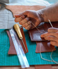 Pro Grade Leather Sewing Awl Kit With Copper Handle, 6 Needle Sizes, Nylon Cord Thread, And 2 Thimbles for leather repair.