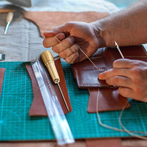 Pro Grade Leather Sewing Awl Kit With Copper Handle, 6 Needle Sizes, Nylon Cord Thread, And 2 Thimbles for leather repair.