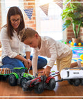 Child playing with Friction Powered Farm Tractor Trailer Toy Set 16 Inch Three Pack For Kids featuring a red tractor and water tank.