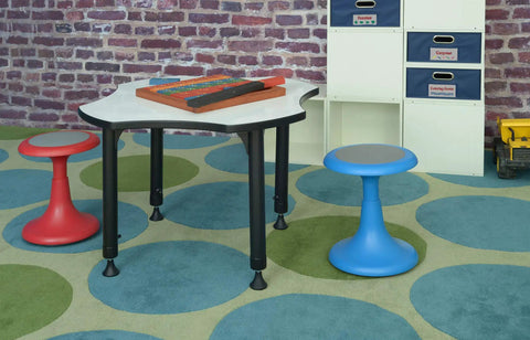 Glow 15 Inch Blue Stool For Classrooms And Playrooms With Convex Base Kid Friendly Circle Time Seating next to activity table