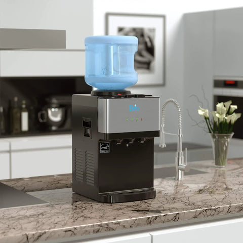 Limited Edition Top Loading Countertop Water Cooler Dispenser With On Demand Hot Cold And Room Temperature Water Tri Temp UL And Energy Star Approved Stainless Steel Reservoirs Kid Safe Lock on kitchen counter