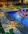 Two Pack Solar Lanterns Outdoor Waterproof Bronze Moon Star Sun Design Lights casting patterns by poolside, creating cozy vibes