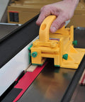 Grr-Rip Block 3D Pushblock System For Table Saws in use guiding wood on table saw with Gravity Heel, Smart Pushblock, Yellow.