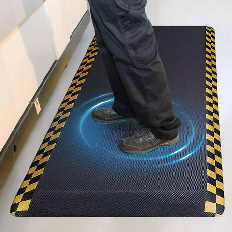 Heavy-Duty Anti-Fatigue Standing Mat 39 By 20 Inches With Safety Yellow Border in use in workshop for ergonomic cushioning