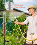 Man watering garden near Solar Powered Rain Gauge With LED Night Light Outdoor Garden Stake Decoration 7 Inch Plastic Tube