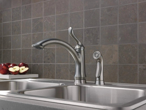 Linden Single-Handle Kitchen Faucet With Side Sprayer in Brushed Nickel installed in modern tiled kitchen sink area