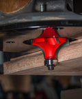Freud Quadra Cut One Half Inch Radius Rounding Over Router Bit For Pro Woodworking With Four Flutes installed in a router