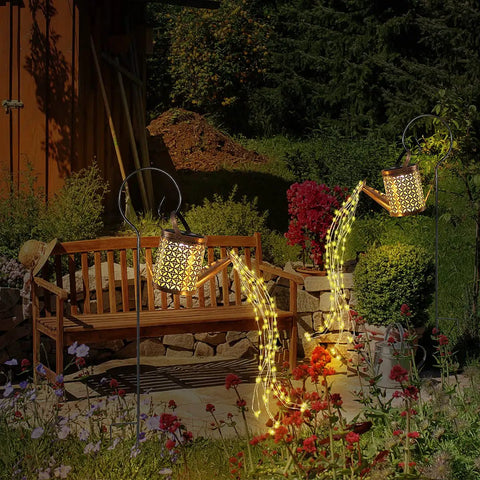 Solar Garden Watering Can With Lights, Outdoor Hanging Cascading Lanterns illuminating patio garden at night