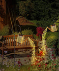 Two Pack Solar Watering Can Garden Lights, Hanging Waterproof Lanterns For Outdoor Decor glowing near bench