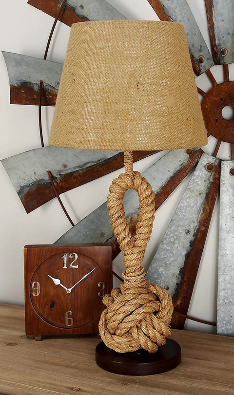 Jute Rope Table Lamp With Linen Shade Rustic Twisted Rope Accent Lamp For Living Room Cozy Warm Glow Industrial Natural Decor 13 By 13 By 28 Inches Brown on a wooden table with a clock and metal wall art.