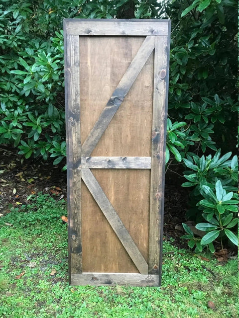 Space Saving Rustic Wood Mountains Sliding Barn Door For Home, 34 x 82 inch, classic farmhouse style against greenery
