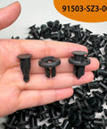 Kickstart Your Ride Fix With Heavy Duty One Hundred Piece Bumper Clip Set For Honda And Acura Vehicles Including Civic Accord Crv Bodies Featuring Rock Solid Nylon Retainer Pins Plus Quick Install Tool Included, showing black nylon clips in hand.