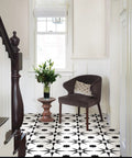 Interior with chair and table on white and black peel and stick vinyl floor tiles 12 by 12 inches pack of 10 no grout needed.