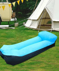 Portable blue inflatable lounger camping couch for adults and kids, air sofa chair for outdoor use, pictured on grass