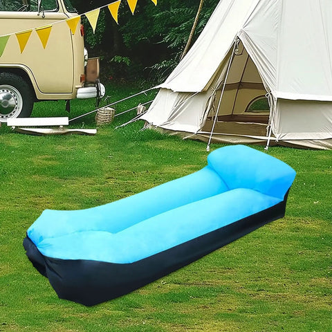 Portable blue inflatable lounger camping couch for adults and kids, air sofa chair for outdoor use, pictured on grass