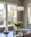 Modern Lattice Drum Pendant Chandelier 3 Light Hanging Light With Glass Diffuser In Brushed Nickel Finish Perfect For Living Room Or Dining Area Home Decor hanging over a dining table.