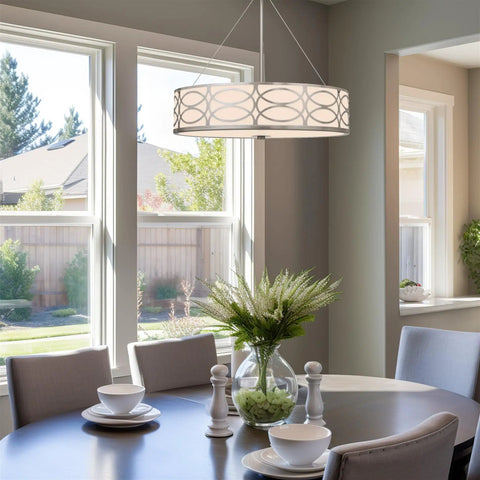Modern Lattice Drum Pendant Chandelier 3 Light Hanging Light With Glass Diffuser In Brushed Nickel Finish Perfect For Living Room Or Dining Area Home Decor hanging over a dining table.
