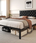 Queen Platform Bed Frame With Swanky PU Leather Upholstered Headboard And Plush Memory Foam Backrest Heavy Duty Metal Slat Support Hidden Underbed Storage No Sweat Setup Black in a modern bedroom with storage boxes.