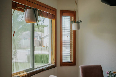 Room interior with windows featuring Ultra Fine Mosquito Netting Sheet No See Um Mesh for indoor outdoor use hanging beside window.