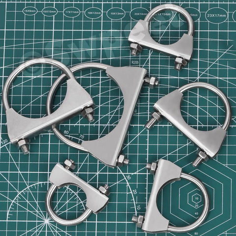 Multiple stainless 1.3 inch U-bolt clamps on a grid mat, part of Exhaust U Clamp Kit 2 Pieces 1.3 Inch Stainless Steel U-Bolt Clamps